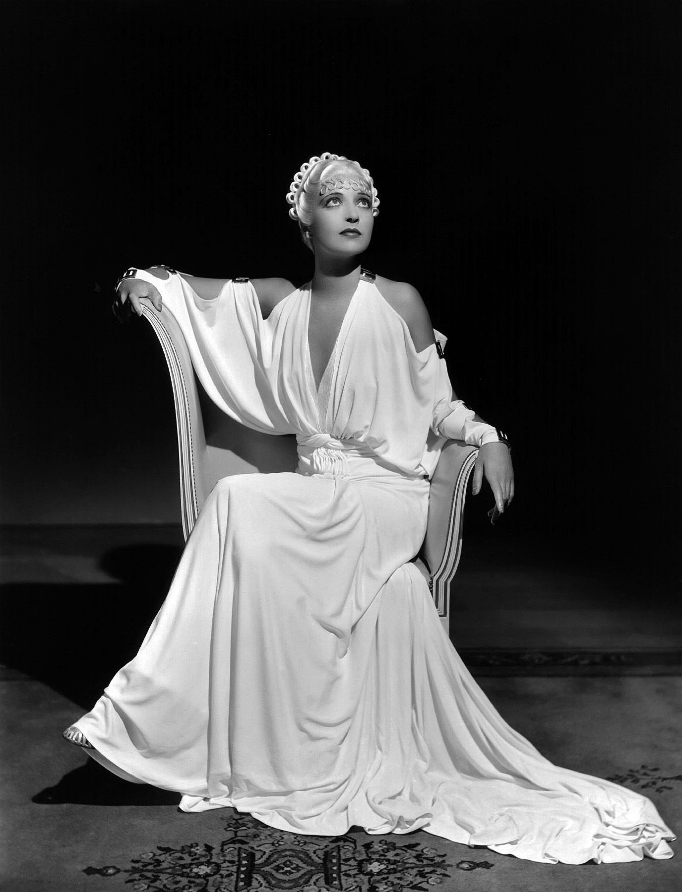 Not totally sure who this is. I thought Bette Davis, but maybe Dolores del Rio in a blonde wig? Either way, this dress is killer .