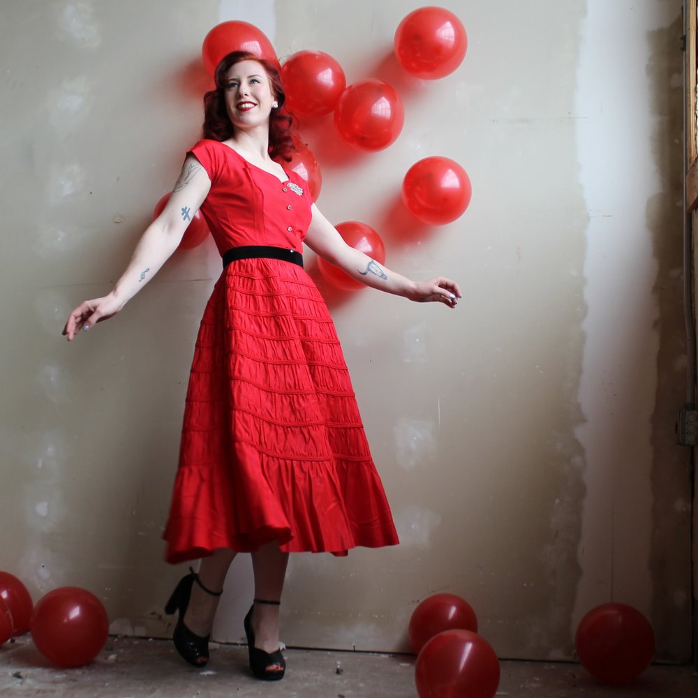 You can't really do much set dressing out in the real world, but even something as small as taping a few balloons to a wall added just the right touch to this Valentines themed photo shoot.