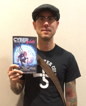 Jason Heller, editor of Cyber World. At MileHiCon, Denver, October 2016. Mugshot by Lisa Mahoney.