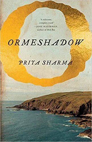Ormeshadow book cover. Image description: a golden “O” floats above the a photograph of seaside cliffs. Cover Design by Henry Sene Yee . Photo from Shutterstock.com.