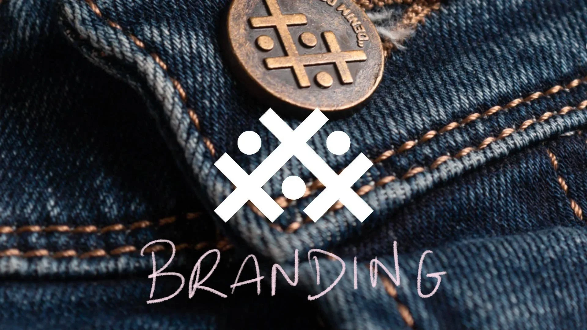 Denim company brand mark over a pair of jeans