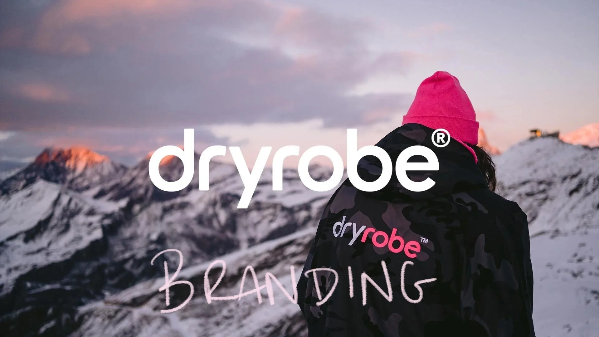 Custon Dryrobe logotype on an Alpine background