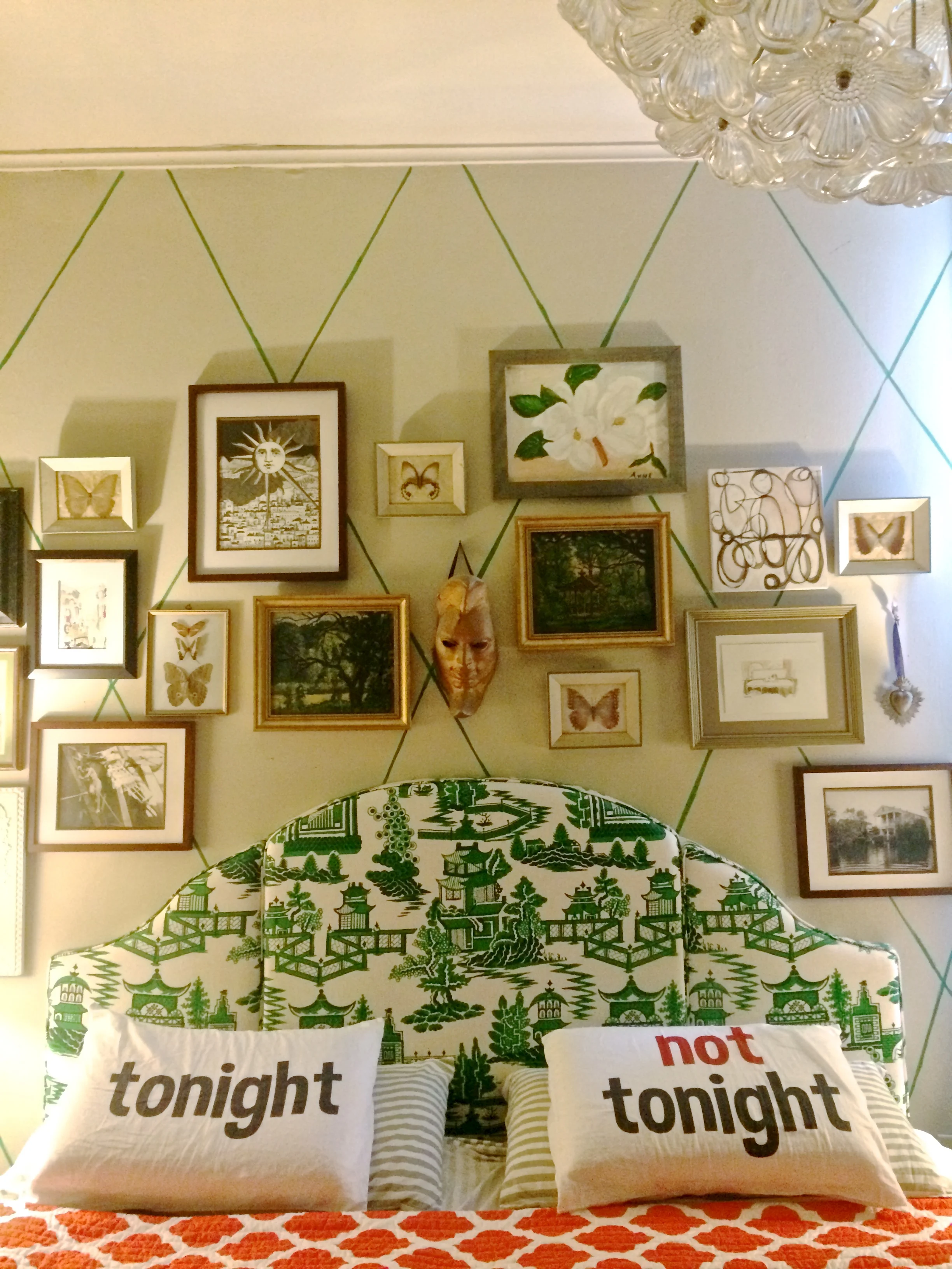 cheeky pillows, ecletic art, and great headboard/blanket color & pattern combination