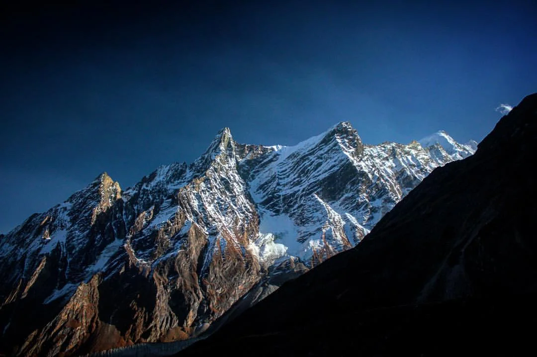 Risking waffling some donkey dung or falling off a mountain side path as wide as my boot's shoelace, I finally looked up to notice this craggy little knoll. — at Manaslu Circuit Trek .
