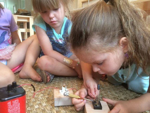 Children learning about circuits