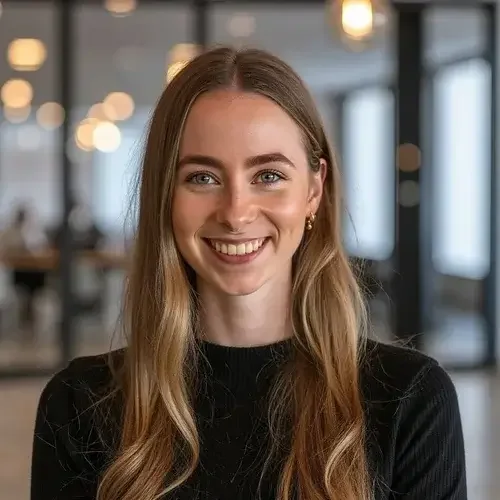 Young woman from Best Brisbane Criminal Law Firm Brisbane with long, wavy blonde hair and blue eyes in office