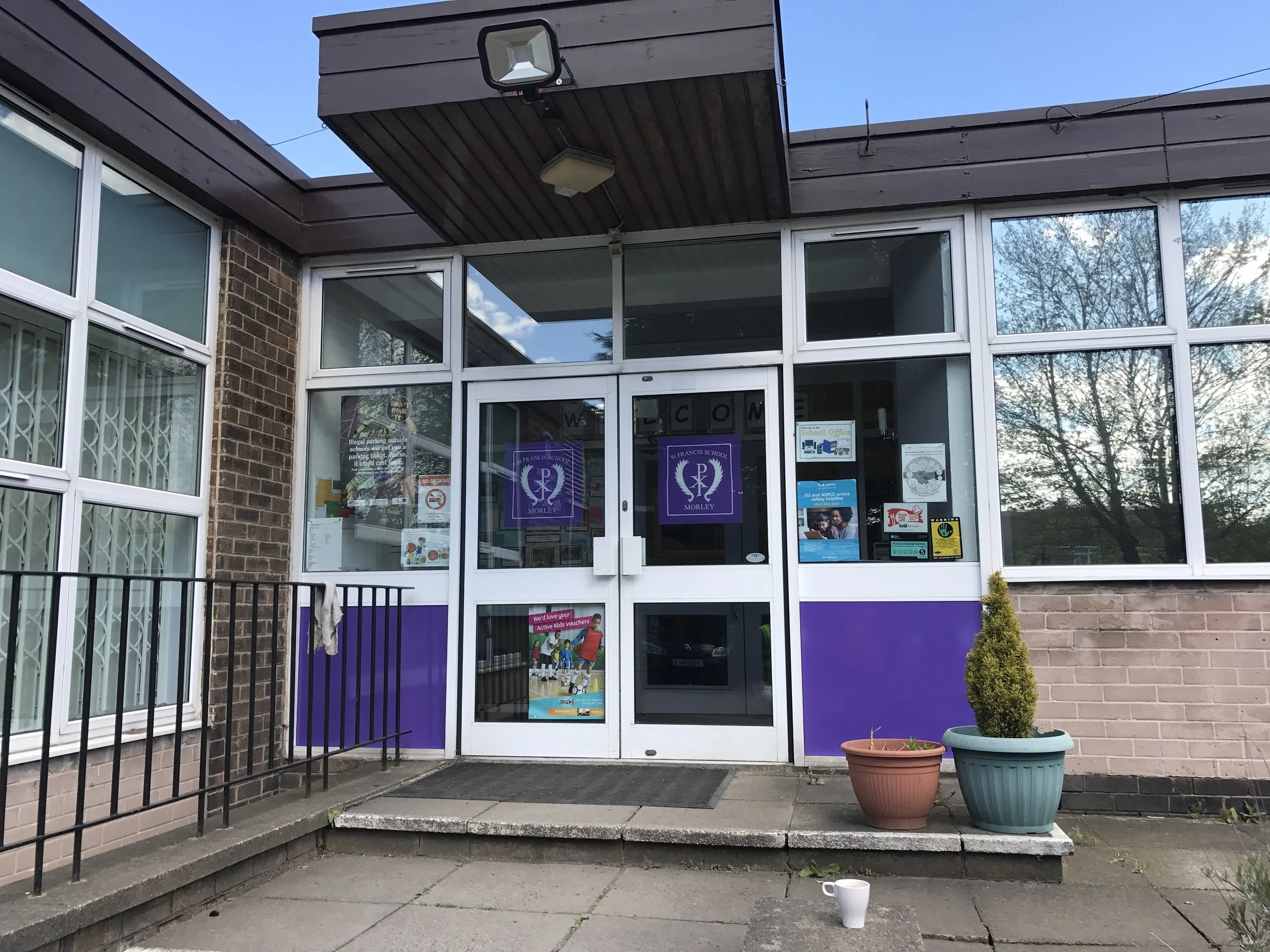 AFTER: The window coverings are now in the school colours