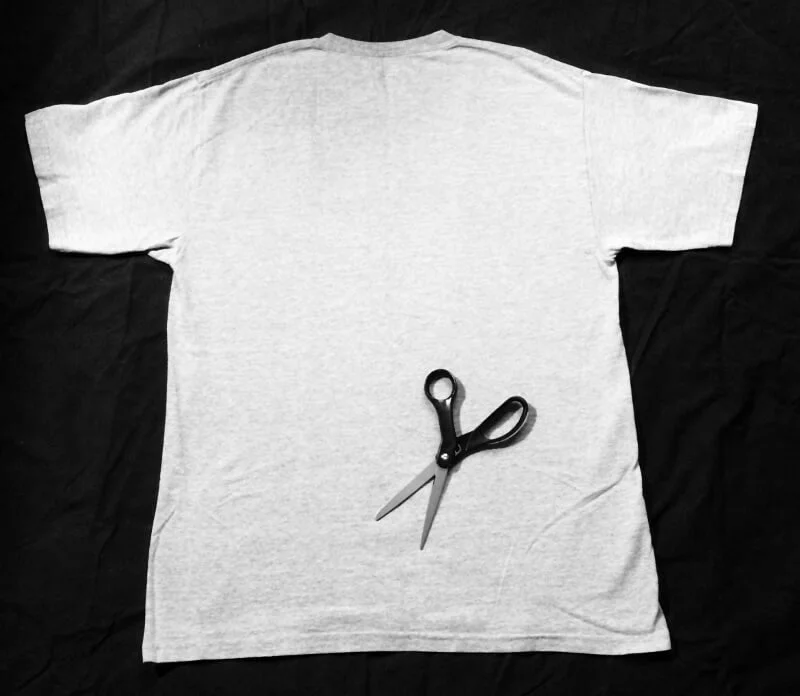 First solo shirttail cutting tradition — t-shirt and scissors