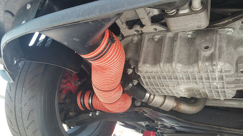 The ducts just provide some additional fresh air right to the hub area, where hopefully the rotors will pick it up and flow it through their cooling vanes.