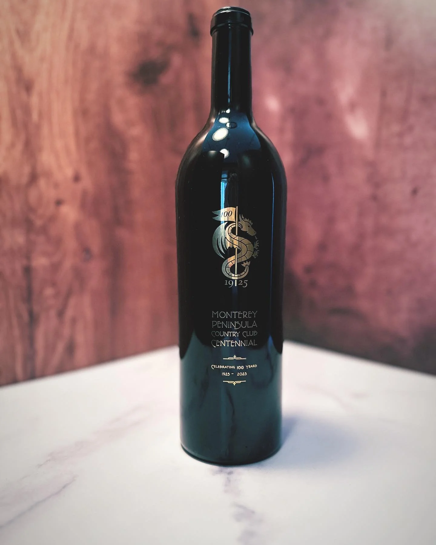 Snapshot of a recent silkscreened wine label design we did for Country Club&rsquo;s 100th anniversary.
We chose a typography style that was popular a century ago for a bit of nostalgia. #artdeco #realgold