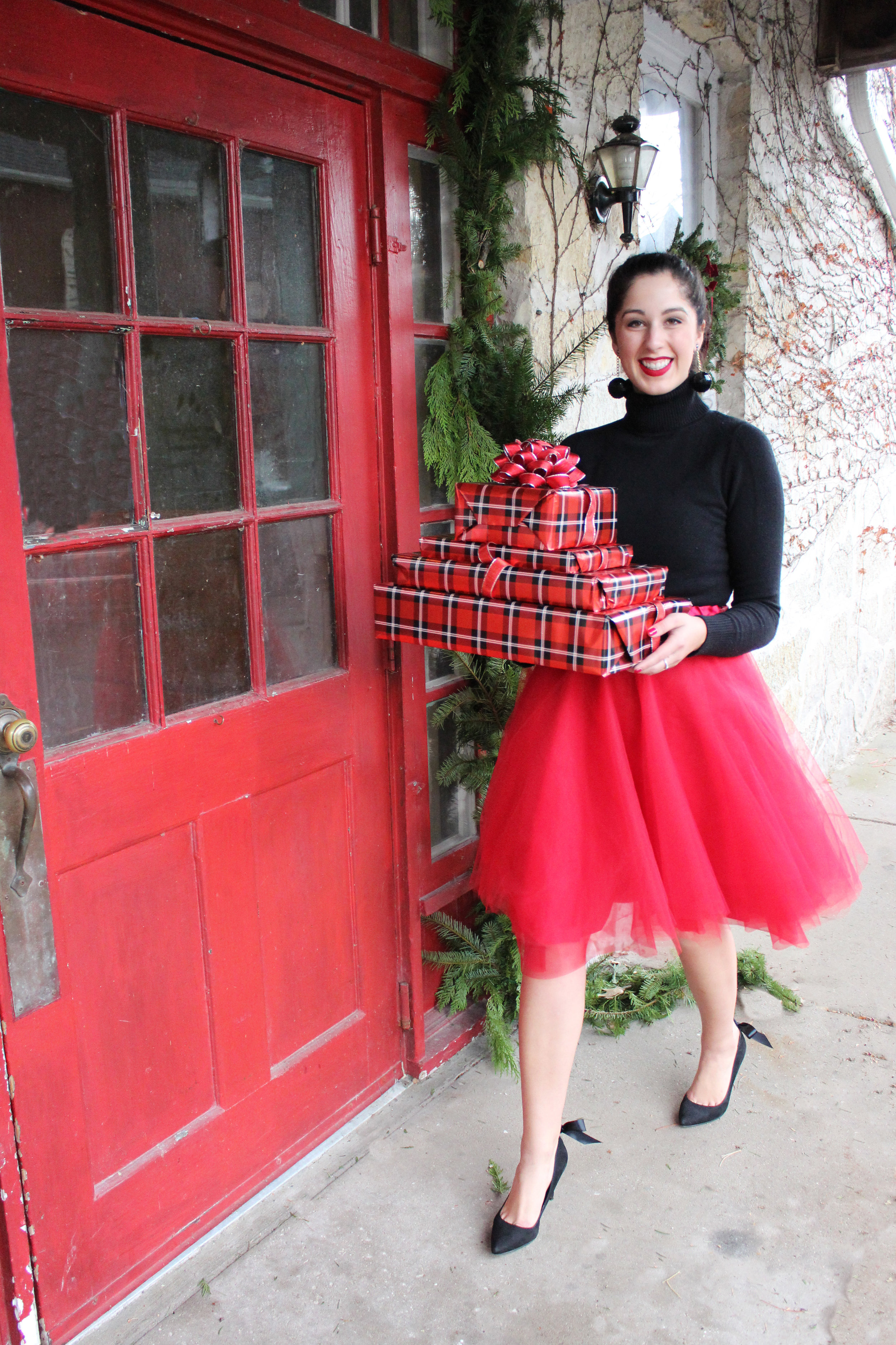 Madalyn Manzeck photographed by Cassie Sterwald in Cedarburg, WI in 2016. Red tulle skirt Madalyn Joy Designs | Black turtleneck sweater French Connection | Black bow heels Aldo | Red heart flats Christian Louboutin | Vintage black sequin earrings | Red matte lipstick Stila