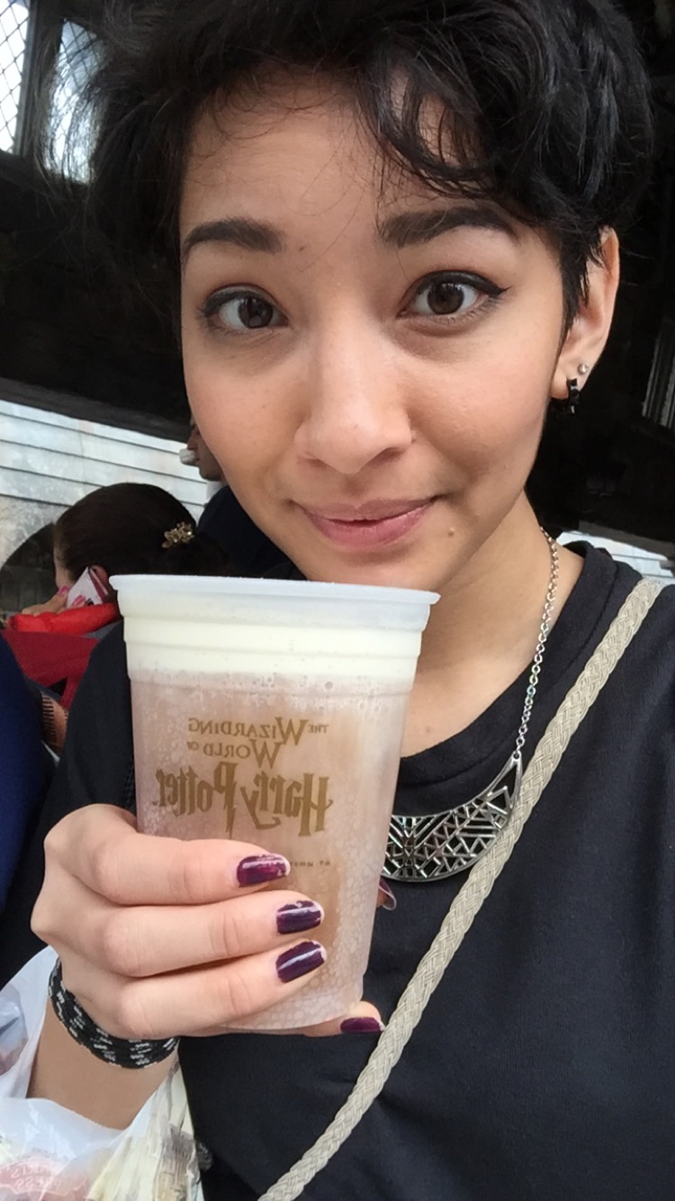 Vanali enjoying her cup of Butter Beer, a creamy butterscotch soda, at Harry Potter World in Orlando, FL. 