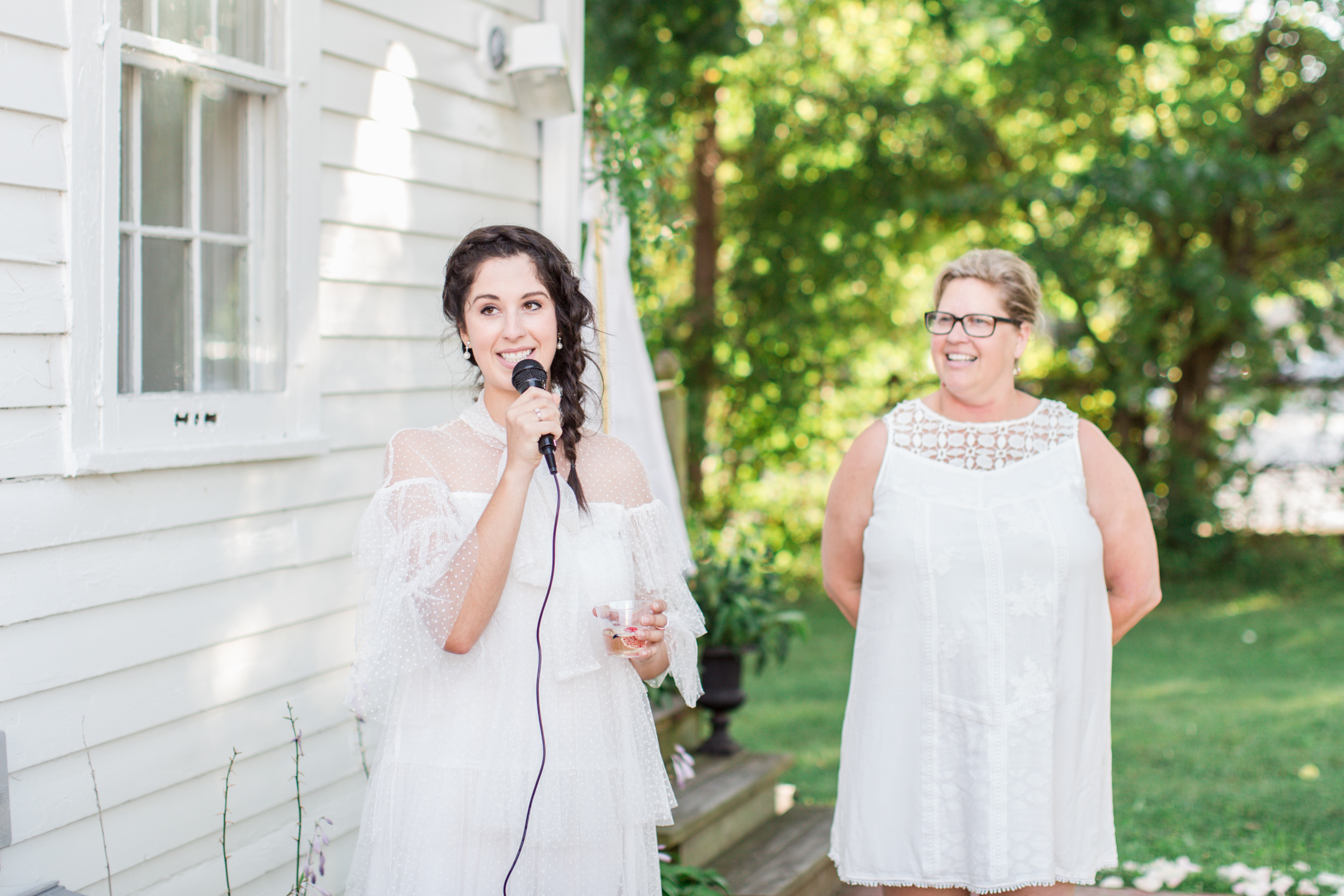 Madalyn Manzeck of Madalyn Joy Designs and Vicki Kunz of La Tulipe welcoming the guests to their garden party. 