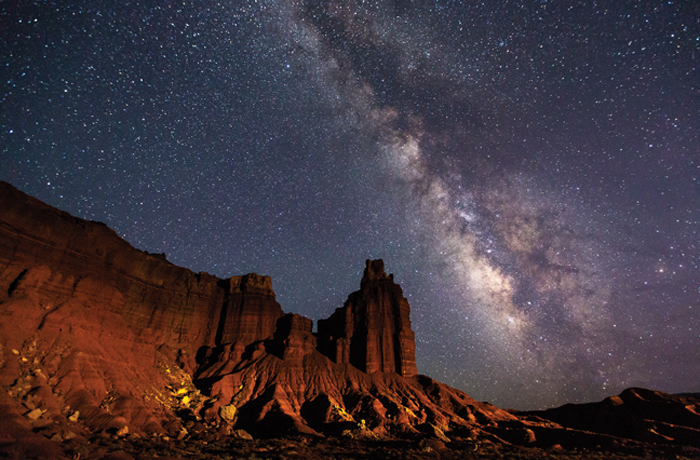The Milky Way arches over Capitol Reef National Park’s iconic Chimney Rock. Photo by Jacob W. Frank.