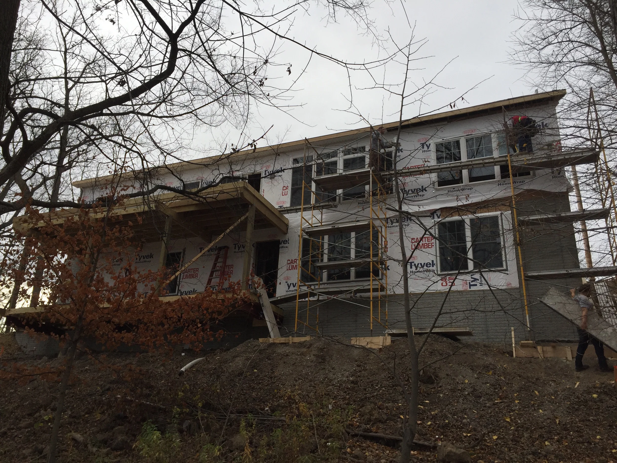 With second story eaves close 25' off the ground and built into a shear cliff, this build was not for the faint of heart.