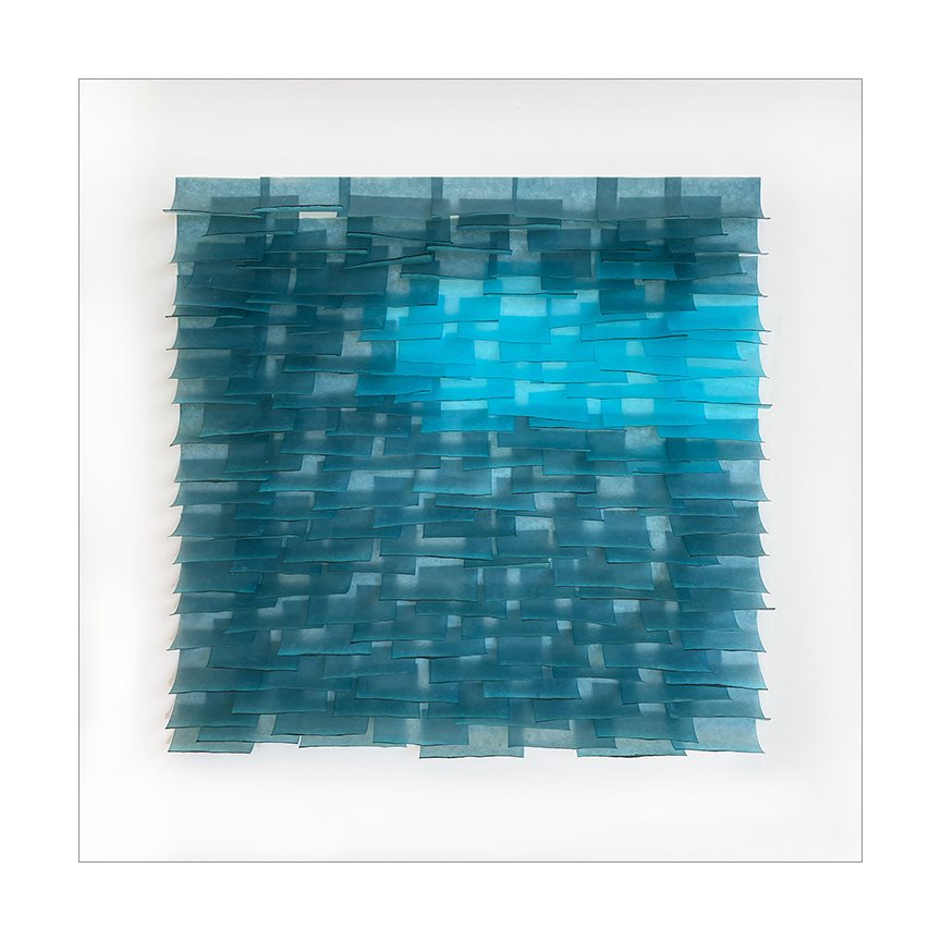 Flutter 2025 3 Mulberry paper, watercolor, wax 12 × 12 x .75 inches The Flutter series is designed to evoke the texture of ocean water. The pieces in this series attempt to capture the ever-changing light, transparency and movement of the ocean’s