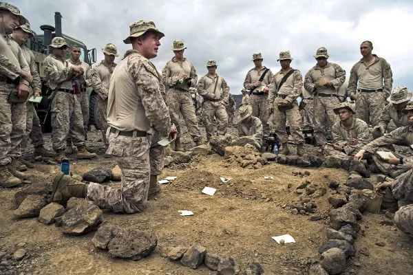 U.S. Marines receive a sand table briefing before a platoon assault exercise on Arta Range, Djibouti, Feb. 10, 2014. (U.S. Air Force photo by Staff Sgt. Erik Cardenas)