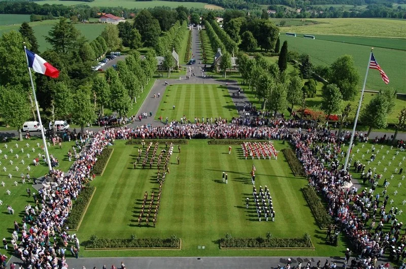 BELLEAU, France — French Army and U.S. Marine Corps ceremonial elements, along with approximately 2,000 tourists and local nationals, gather at the parade deck of the Aisne-Marne American Cemetery during the 91st annual Memorial Day ceremony there. Each year, thousands of U.S. and French service members, their families, tourists and locals, gather to honor the memories of the 2,289 war-dead buried at the cemetery. (via EUCOM.mil, Department of Defense photo by Marine Cpl. Lydia Davey)