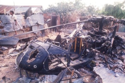 A child walks near the wreckage of an American helicopter in Mogadishu, Somalia on October 14, 1993. (Scott Peterson/Liaison, Getty)