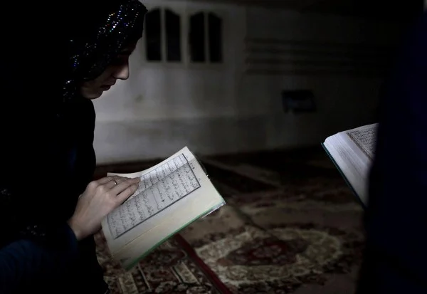 Chechen teens study the Koran at an underground medrese. In today’s Chechnya, Chechen youth are quick to embrace Islam after decades of religious repression in the Soviet Union. | Images © Diana Markosian