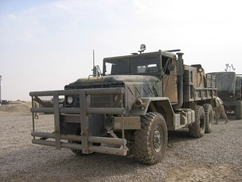 A U.S. Army 5-ton cargo truck with improvised armor on the doors, rear gunner’s box, and an improved bumper. (Photograph taken by Jeff McFall at LSA Adder, Iraq)