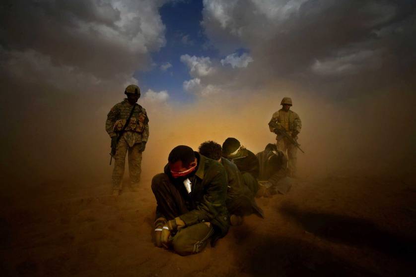 Marines organize transfer of detainees as a part of Operation Steel Curtain in 2005. (Jehad Nga/Corbis)