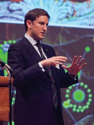 Former British Infantry officer Emile Simpson addresses the attendees at the 2013 Maneuver Warfighter Conference (U.S. Army)