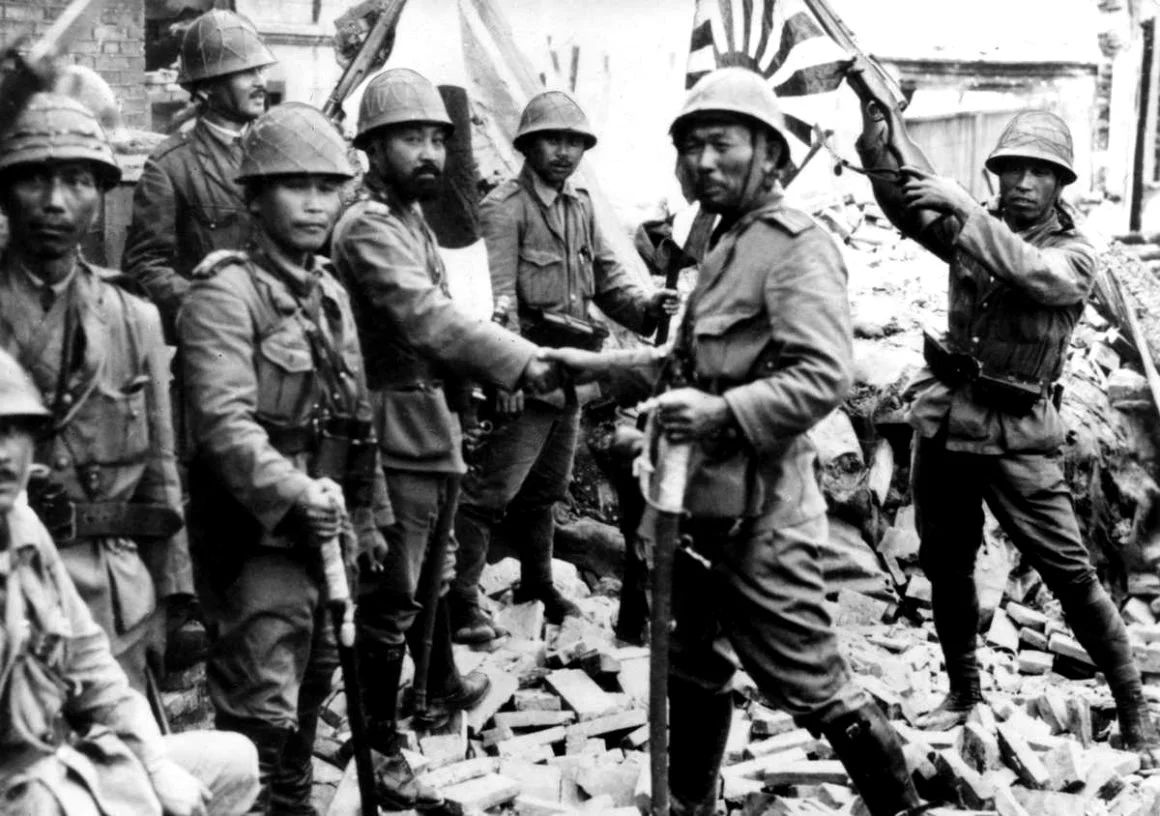 Imperial Japanese Army officers and sailors celebrate the capture of Shanghai during the Second Sino-Japanese War. Shanghai, November 1937.