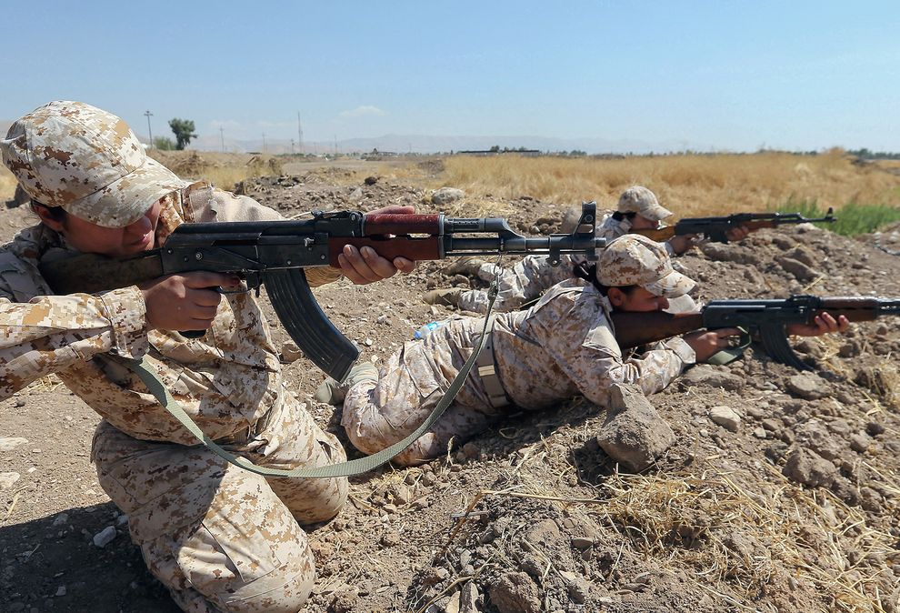 Kurdish women in a Peshmerga battalion take part in a training exercise near Sulaymaniyah, Iraq (Photograph by Mohamed Messara)