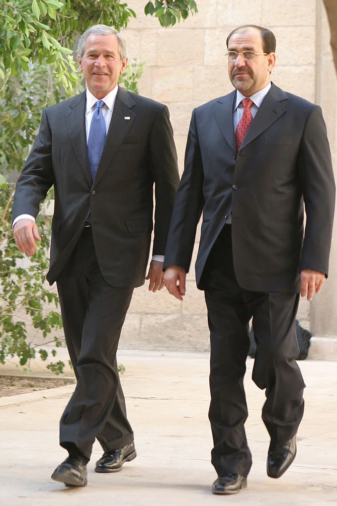 President George Bush conducted weekly teleconferences with Prime Minister Nuri Mali . Maliki would lose his close relationship with the White House after the election of President Barack Obama. Photo courtesy of the White House . 