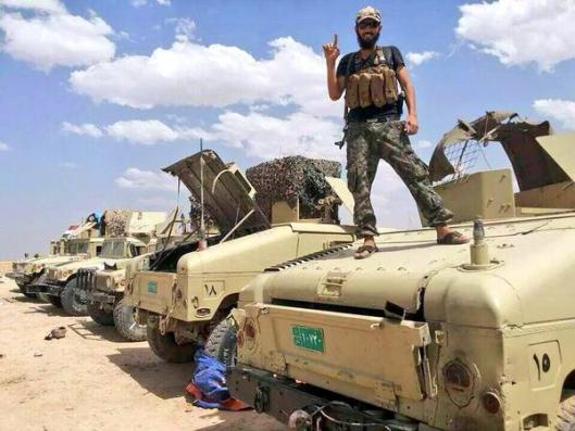 ISIL fighters on U.S. provided equipment after the fall of Iraq Security Forces in Mosul. Photo courtesy Syrian Free Press.