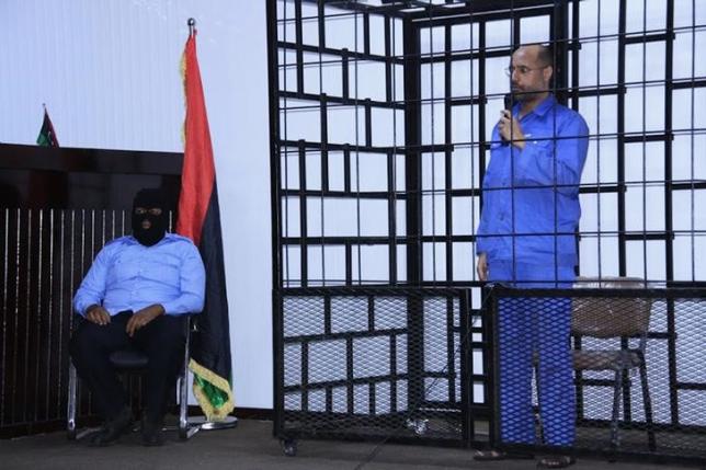 "We will win." Saif al-Islam Gaddafi attends a hearing behind bars, June 22, 2014. ( Reuters )