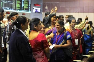 Indian Space Research Organization scientists and engineers cheer after India’s Mars orbiter successfully entered the red planet’s orbit, at their Spacecraft Control Center, in this photo taken through a glass panel, in the southern Indian city of Bangalore September 24, 2014. (Reuters, Abishek Chinnappa)