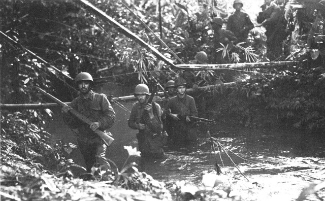 Men of the 172nd Infantry ford a stream on New Georgia. (Cartwheel: the Reduction of Rabaul)