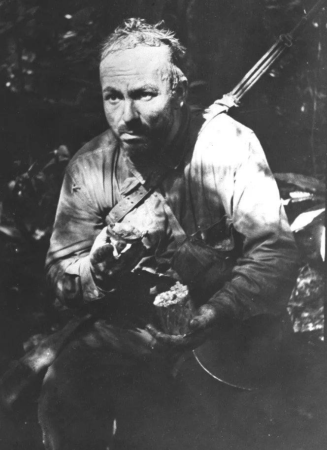 U.S. Army Private Lloyd Culuck of A Company, 1st Battalion, 172nd Infantry, July, 1943. The hollow-eyed look, rotting clothes, and attitude of paranoia mixed with exhaustion was a common site on New Georgia. (Source: National Archives)