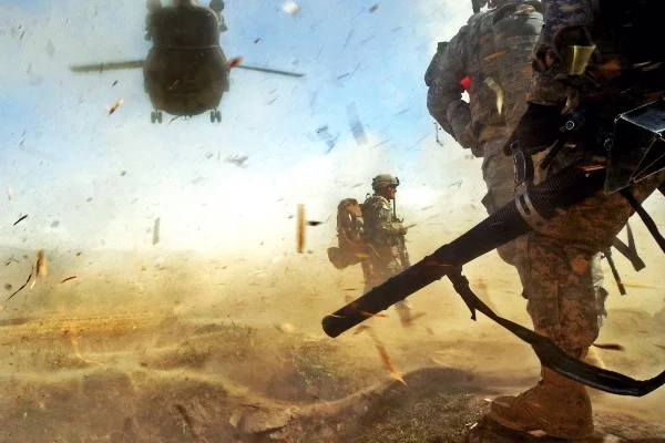 Paratroopers from 3rd Platoon, Company B, 3rd Battalion, 509th Parachute Infantry Regiment, 4th Brigade Combat Team, 25th Infantry Division prepare to load a CH-47 Chinook Helicopter in the Bermel District of the Paktika province in eastern Afghanistan, Oct. 13, during an air-assault mission to detain a known militant. (Photo by U.S. Army Pfc. Andrya Hill, 4th Brigade Combat Team, 25th Infantry Division Public Affairs)