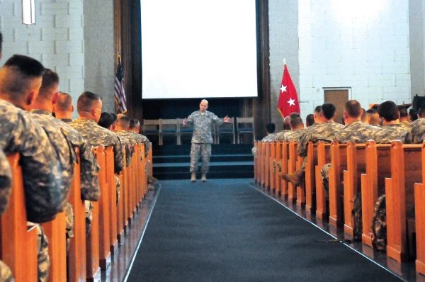 Maj. Gen. Richard Mustion, commander, Army Human Resources Command, discusses major issues and upcoming changes involving the Officer Evaluation Reporting system during a briefing at the Main Post Chapel, Jan. 23. Mustion met with captains through colonels to talk about the new OER system and how it will help the Army maintain the best and most-qualified officers for future leaders. Photo by Sgt. Matthew Ryan 25th Infantry Division Public Affairs.