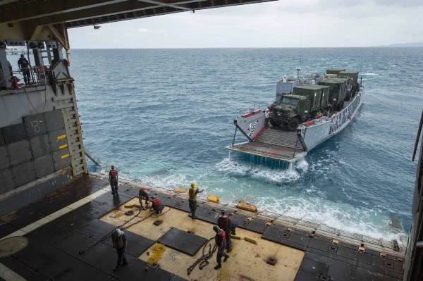 Landing Craft Utility 1633, departs the Whidbey Island-class amphibious dock landing ship USS Ashland (LSD 48) with vehicles assigned to the 31st Marine Expeditionary Unit (31st MEU) after a stern gate marriage. Ashland is part of the Bonhomme Richard Amphibious Ready Group and is conducting joint force amphibious operations in the U.S. 7th Fleet area of responsibility. (U.S. Navy photo by Mass Communication Specialist Seaman Raymond D. Diaz)