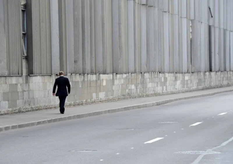 Putin walking alone after the funeral of his Judo Coach