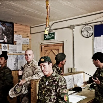A Marine with Afghan soldiers at the ANA base, Camp Garmsir.
