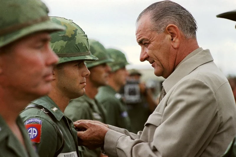 Johnson awards a medal to a US soldier during a visit to Vietnam in 1966.