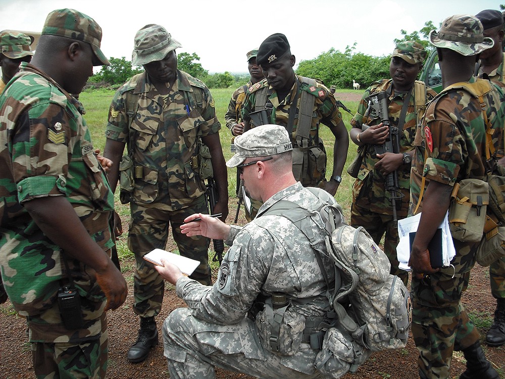 Sgt. 1st Class Grady Hyatt, U.S. Army Africa, leads an after-action review with soldiers of the Ghana Army, following training. The Army aligned the 2nd Brigade Combat Team, 1st Infantry Division, with U.S. Africa Command. The unit will serve for a year as the go-to force for AFRICOM. (U.S. Army Photo)