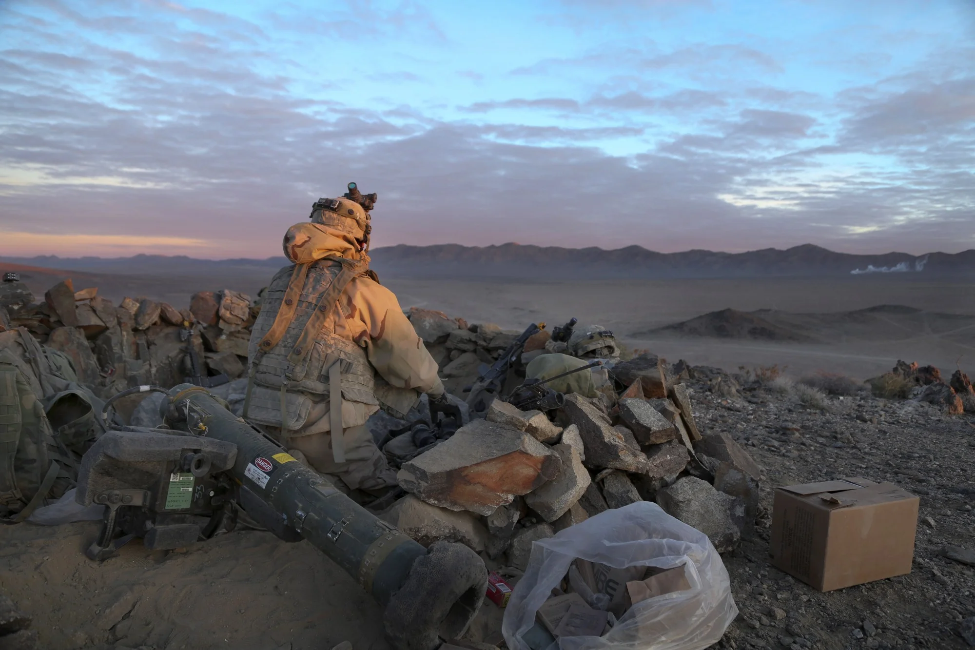 A soldier surveys the area from an observation point during decisive action training at the National Training Center on Fort Irwin, Calif., Jan. 26, 2014 (U.S. Army photo by Sgt. Paul Sale)
