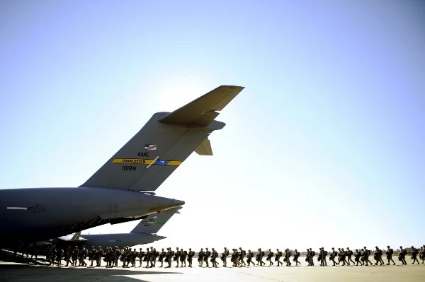 Paratroopers assigned to the 82nd Airborne Division prepare to board a C-17 Globemaster III Feb. 9, 2011, during a joint operational access exercise at Pope Air Force Base, N.C. (U.S. Air Force photo by Staff Sgt. Greg C. Biondo)
