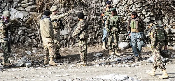 A U.S. Army Soldier discusses with Afghan National Army Soldiers the possible ways of conducting a mission in Nadir Shah Kot District, Afghanistan, Jan. 12, 2013. The mission was aimed at gathering information from village elders and to disrupt possible insurgent activity in the area. (Spc. Brian Smith-Dutton/U.S. Army)