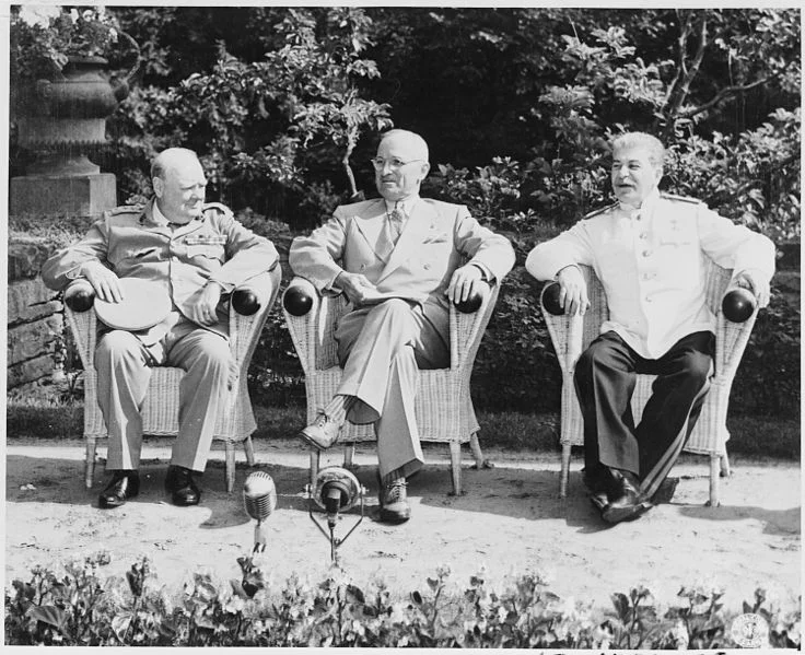 British Prime Minister Winston Churchill, President Harry S. Truman, and Soviet leader Josef Stalin in the garden of Cecilienhof Palace before meeting for the Potsdam Conference in Potsdam, Germany. (Harry S. Truman Library/Wikimedia)