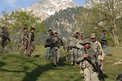 U.S. and Afghan troops on patrol in Nuristan. (Long War Journal)
