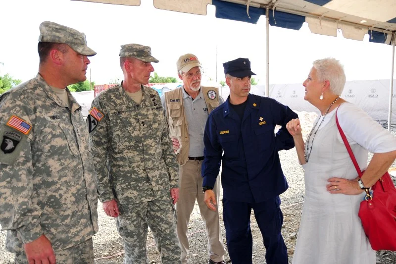 The Modular Division in Action. The 101st Airborne is currently serving as Joint Force Command — United Assistance. The headquarters deployed on short notice, without BCTs, to provide mission command for the Ebola response effort. Pictured here are CSM Hines, the JFC Command Sergeant Major, MG Volesky, the JFC Commander, Mr. Berger, a team leader for the USAID Disaster Assistance Response Team, and RADM Giberson, the Commissioned Corps Ebola Response Commander, all talking with AMB Malac, the U.S. Ambassador to Liberia, just prior to the opening ceremony for the Monrovia Medical Unit on November 5, 2014, in Liberia (DVIDS Photo 1645724, SFC Nathan Hoskins).