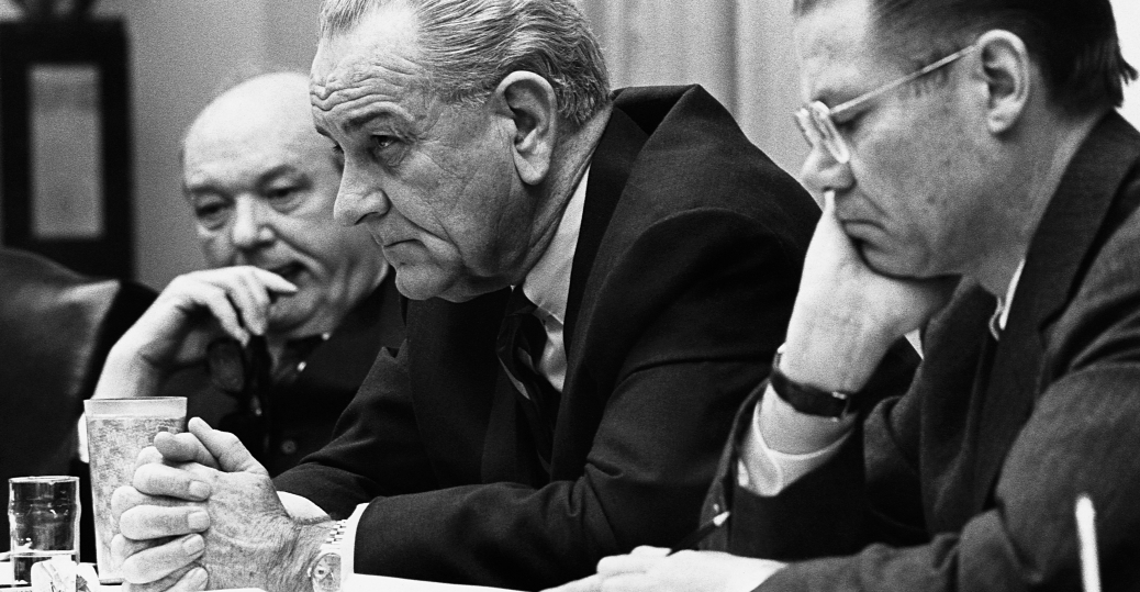 President Johnson meets with Secretary of Defense Robert McNamara and other advisors following the Tet Offensive. (History.com)