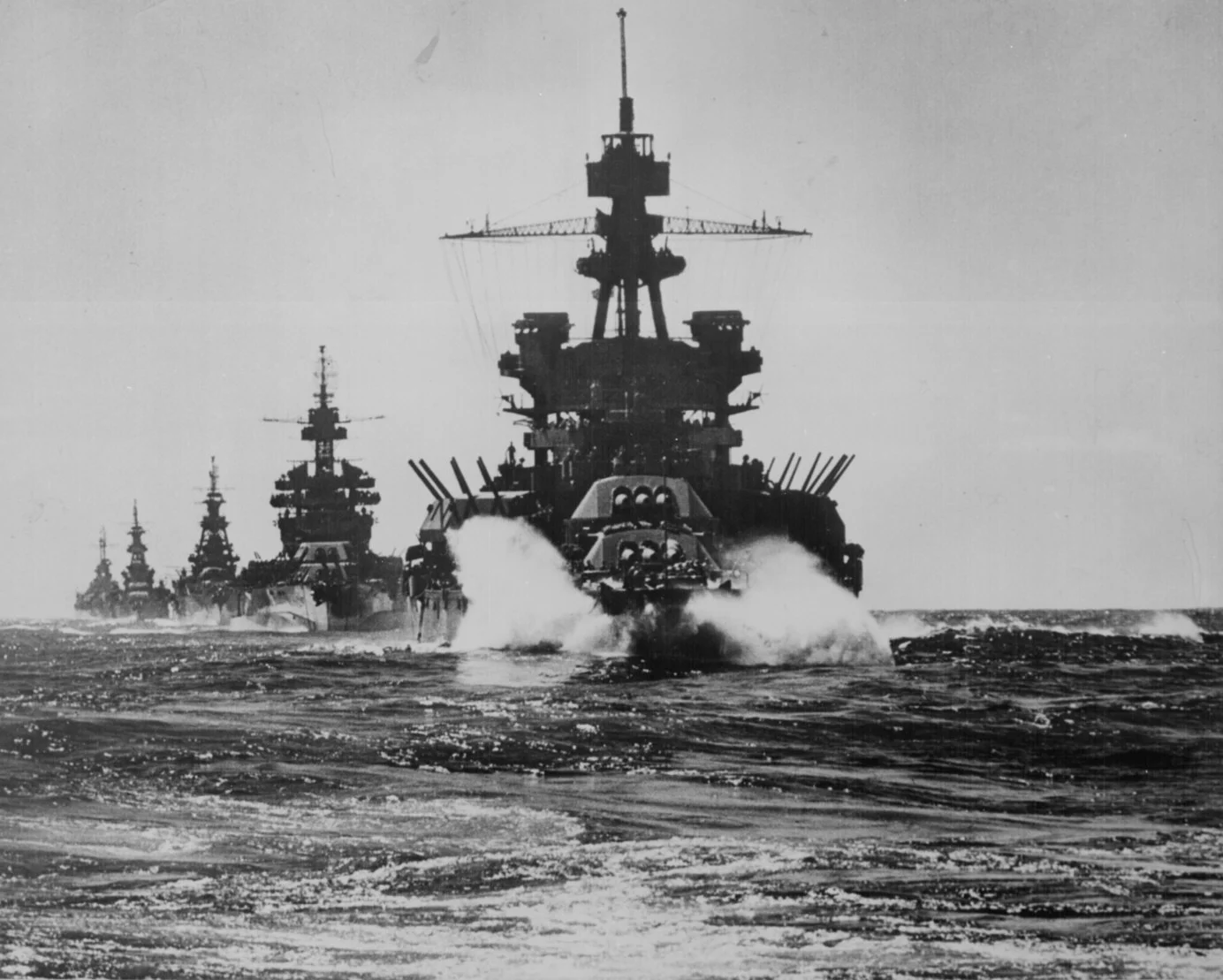 USS Pennsylvania and a Colorado-class battleship followed by three cruisers in Lingayen Gulf preceding the landing on Luzon, Philippines, January 1945. (U.S. Navy Photo/National Archives)